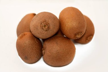 Chilean kiwifruit, Chinese gooseberry is the edible berry of several species of woody vines in the genus Actinidia isolated on white background, Kiwi has a soft texture with sweet flavour