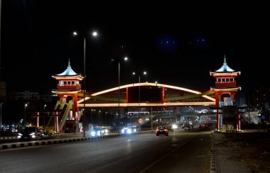 Cairo, Egypt, August 4 2022: Shinzo Abe axis patrol highway in Egypt at night with a pedestrian bridge finished in traditional Japanese architectural style named on former Japanese Prime minister
