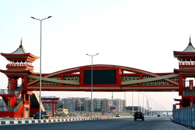 Cairo, Egypt, August 5 2022: Shinzo Abe axis patrol highway in Egypt with a pedestrian bridge finished in traditional Japanese architectural style, the traffic highway is named on former Japanese PM