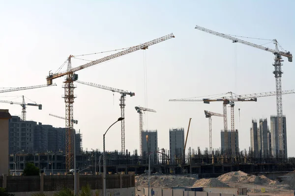 Giza, Egypt, June 6 2022: A construction site of new high rise in Egypt, new buildings construction in Giza developmental project with concrete, steel and crane towers, skyscrapers for residence