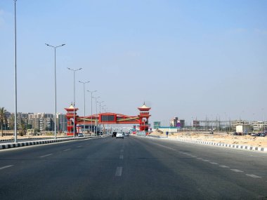 Cairo, Egypt, August 17 2022: Shinzo Abe axis patrol highway in Egypt with a pedestrian bridge finished in traditional Japanese architectural style, the traffic highway is named on former Japanese PM