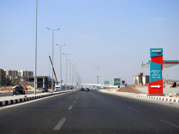 Cairo, Egypt, August 17 2022: Shinzo Abe axis patrol highway in Egypt, the traffic highway is named on former Japanese prime minister with Master gas station, selective focus of Shenzo Abe road