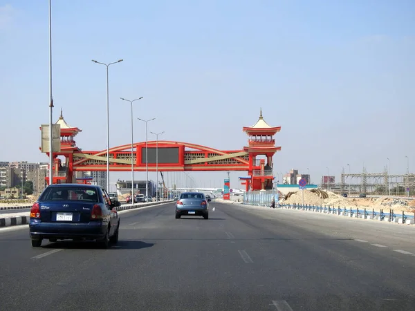 Cairo, Egypt, August 17 2022: Shinzo Abe axis patrol highway in Egypt with a pedestrian bridge finished in traditional Japanese architectural style, the traffic highway is named on former Japanese PM