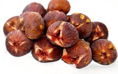stack of figs parchment fruit isolated on white background, fig is the edible fruit of Ficus carica, a species of small tree in the flowering plant family Moraceae, selective focus