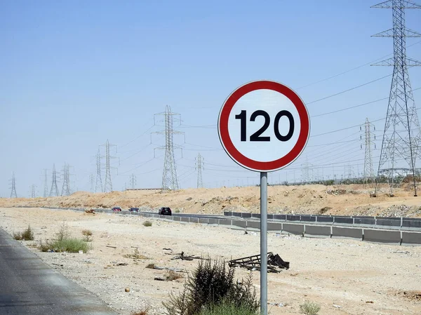 Cairo, Egypt, August 12 2022: 120 KM Speed limit sign in a free highway, one hundred twenty kilometers per hour traffic road sign, a restriction sign for car drivers not to exceed the set speed