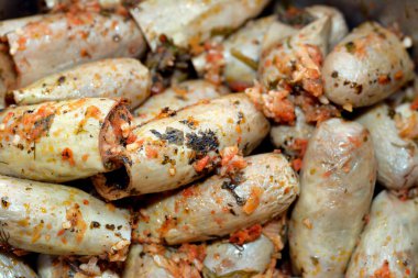 Eggplants Mahshi stuffed with white rice, onion, parsley, dill and coriander, selective focus of Arabic Egyptian traditional cuisine of white aubergine Mahshy filled with rice and cooked
