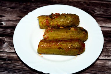 Stuffed squash, courgette, marrow, mahshi, or zucchini filled with white rice, onion, parsley, dill and coriander, selective focus of Arabic Egyptian traditional cuisine of Mahshy