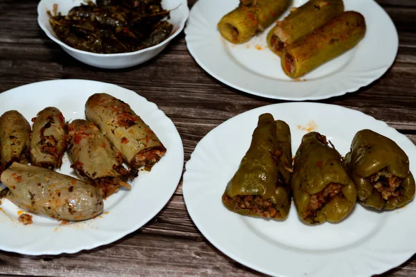 Stuffed squash zucchini Mahshi, eggplants, wrapped grape leaves and bell peppers filled with white rice, onion, parsley, dill and coriander,  Arabic Egyptian traditional cuisine of Mahshy