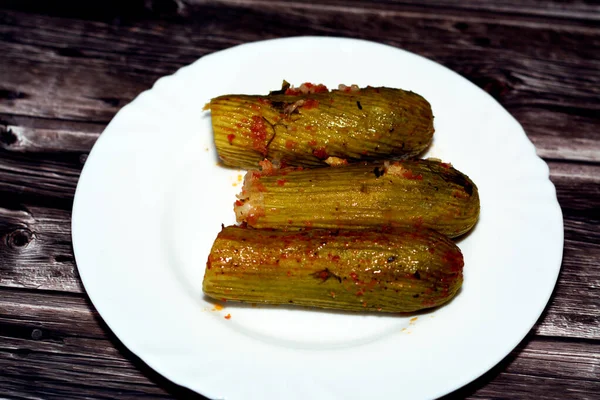 Stuffed squash, courgette, marrow, mahshi, or zucchini filled with white rice, onion, parsley, dill and coriander, selective focus of Arabic Egyptian traditional cuisine of Mahshy