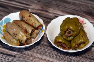 bell peppers stuffed Egyptian mahshi and Eggplants white aubergine Mahshy filled with white rice, onion, parsley, dill and coriander, selective focus of Arabic Egyptian traditional cuisine of Mahshy
