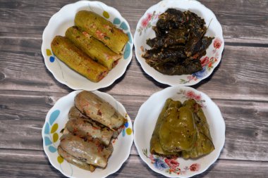 Stuffed squash zucchini Mahshi, eggplants, wrapped grape leaves and bell peppers filled with white rice, onion, parsley, dill and coriander,  Arabic Egyptian traditional cuisine of Mahshy
