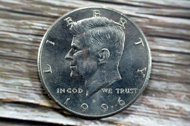 The Kennedy half dollar 50 cent coin issued by the United States Mint year 1996 as a memorial to the assassinated 35th president of the United States John F. Kennedy, selective focus of 1996 D 50C MS