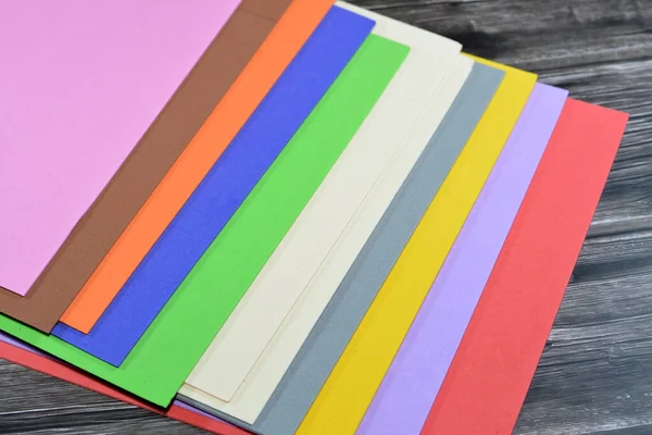 Colorful Eva foam sheets, colored cardboard, rubber pad, sponge papers for school for arts and crafts projects, pile of multicolored school board papers for children, back to school education concept