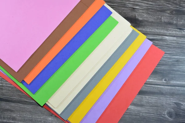 Colorful Eva foam sheets, colored cardboard, rubber pad, sponge papers for school for arts and crafts projects, pile of multicolored school board papers for children, back to school education concept