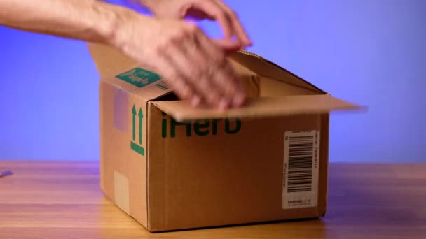 Togliatti, Russia - october 27, 2021: Unpacking box delivered from site iHerb. — 비디오