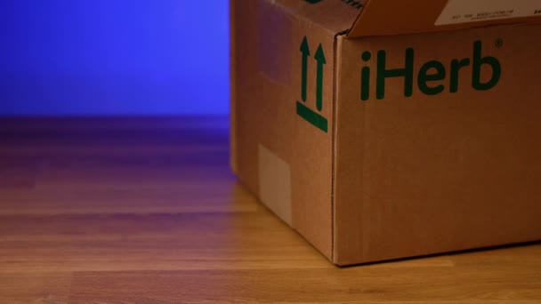 Togliatti, Russia - october 27, 2021: Unpacking box delivered from site iHerb. — Stock Video