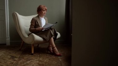 Office worker throws away documents and rejoices. Business woman throws up papers with reports and celebrates victory.