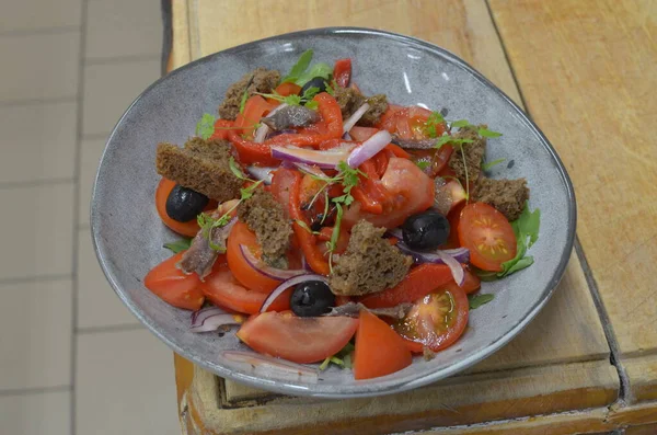 Tuscan Panzanella, traditional Italian salad with tomatoes and bread. Vegetarian panzanella salad. Mediterranean healthy food.