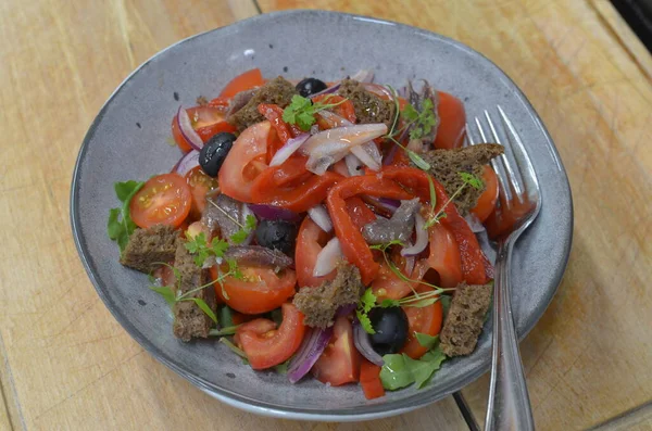 Tuscan Panzanella, traditional Italian salad with tomatoes and bread. Vegetarian panzanella salad. Mediterranean healthy food.
