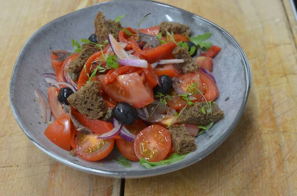 Tuscan Panzanella, traditional Italian salad with tomatoes and bread. Vegetarian panzanella salad. Mediterranean healthy food.