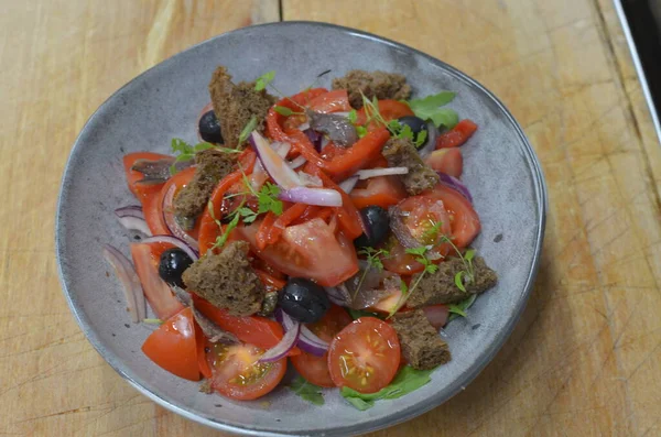 Tuscan Panzanella, traditional Italian salad with tomatoes and bread. Vegetarian panzanella salad. Mediterranean healthy food.