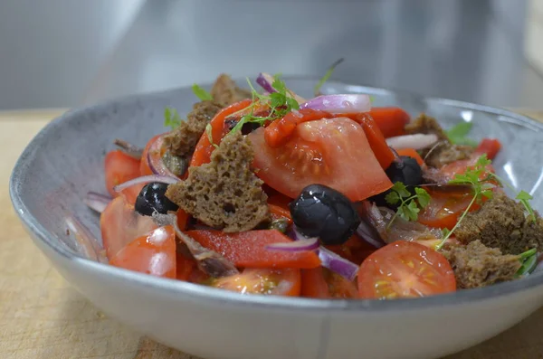 Tuscan Panzanella, traditional Italian salad with tomatoes and bread. Vegetarian panzanella salad. Mediterranean healthy food.