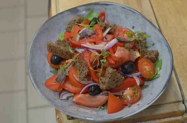 Tuscan Panzanella, traditional Italian salad with tomatoes and bread. Vegetarian panzanella salad. Mediterranean healthy food.