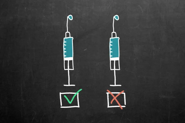 Vaccination hesitancy. Vaccine hesitancy. Two syringes with check boxes. Concept about choosing to get vaccinated. Vaccine hesitancy.Vaccination controversy. freedom of choice on vaccination. Vaccination choose.