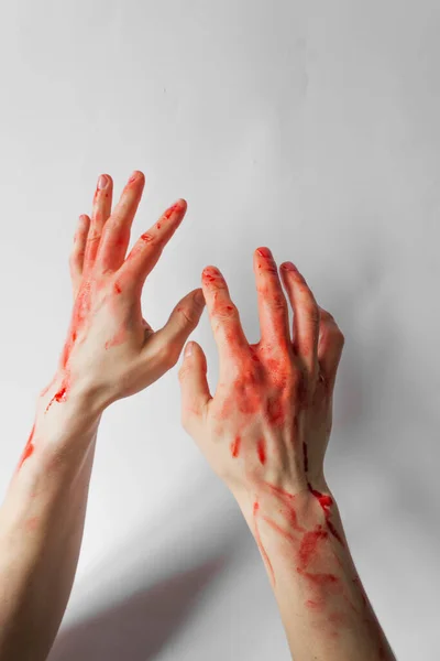 Bloody man hands isolated on white background. Hands of a murderer and a rapist. Halloween concept. — Photo