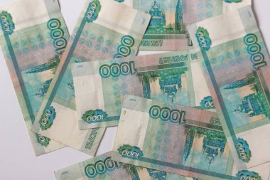 Russian money, banknote face value of one thousand rubles. Fall and devaluation of the russian ruble, crisis. World economic sanctions for Russia because it is a terrorist state. Stop war in Ukraine.