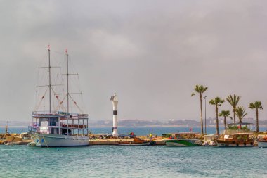 Side, Turkey - May 4, 2022. Pleasure tourist boats stand in the harbor against the sky on a sunny day