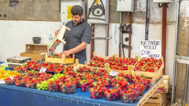 Fethiye, Turkey - May 10, 2022. Fresh strawberry seller at city market