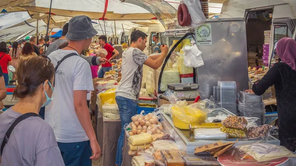Fethiye, Turkey - May 10, 2022. Fresh homemade cottage cheese and cheese are sold at the street market. Close-up