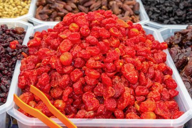 Dried tomatoes are sold at the street market. Close-up