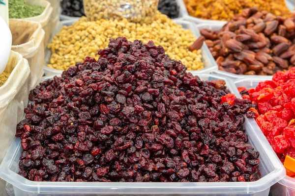 Dried cherries are sold at the street market. Close-up