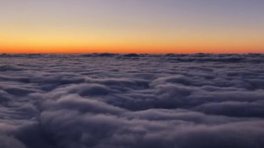 View above the clouds in the mountains. Huge cloud cover.