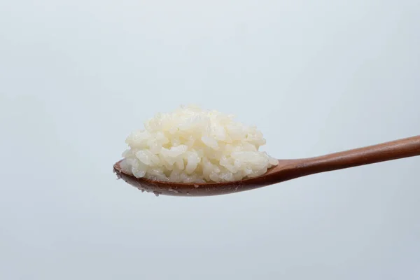 Білий Рис Ложці Білому Тлі — стокове фото