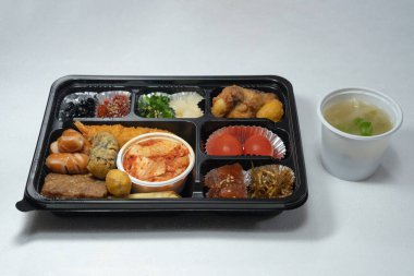 Assorted lunch box with various Korean side dishes