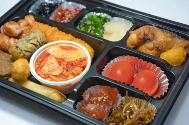 Assorted lunch box with various Korean side dishes