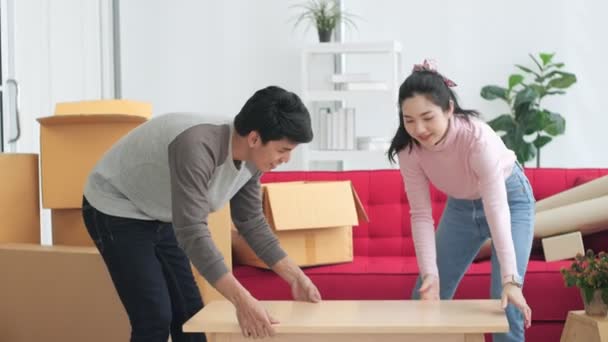 Asian Couple Carrying Big Wooden Table Decide Decoration New Home — Stok video