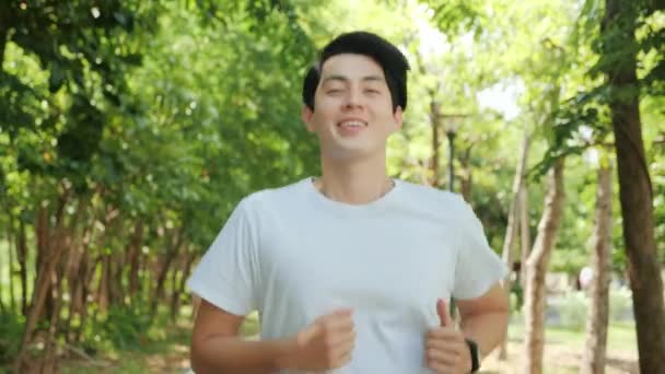 Happy Handsome Asian Man Running Park Public Green Background Fit — Vídeo de stock