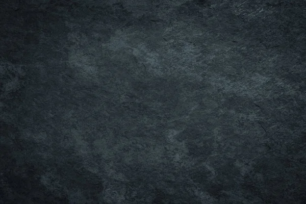 Koyu kasvetli siyah grunge yüzey arkaplanı ile lekeli doku