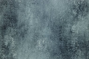 Grunge messy stucco wall surface with a decorative canvas pattern.