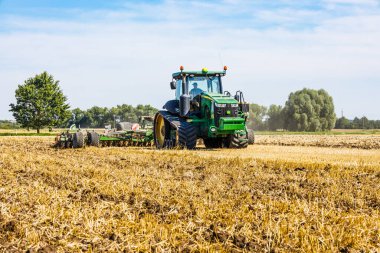 Industrial combine machine in working prosses. Simnas, Lithuania, 13 August 2022.