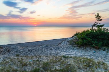 Sunset at the Baltic sea shore. Typical Baltic sea beach landscape.