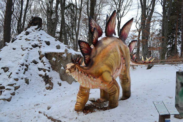RASNOV, ROMANIA - DECEMBER 30, 2016: Stegosaurus park next to Rasnov fortress.