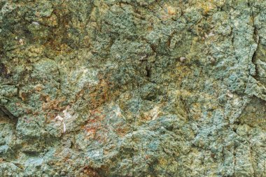 Duvar dokusu, dağ taşı, yeşil tonlarda arka plan, haki rengi..