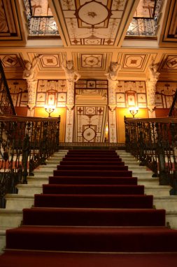 CORFU, GREECE - AUGUST 11, 2018: Interior of the Sissi Palace, the main hall and staircase at Achilleion. clipart