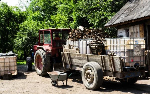 Tractor Firewood Distillation Vessel Containers Marc Brandy Wheelbarrow Transport — Stock Photo, Image