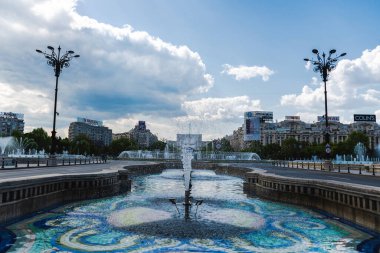 BUCHAREST, ROMANIA - MAY 18, 2022: Union square with the artesian fountains and the House of the people.